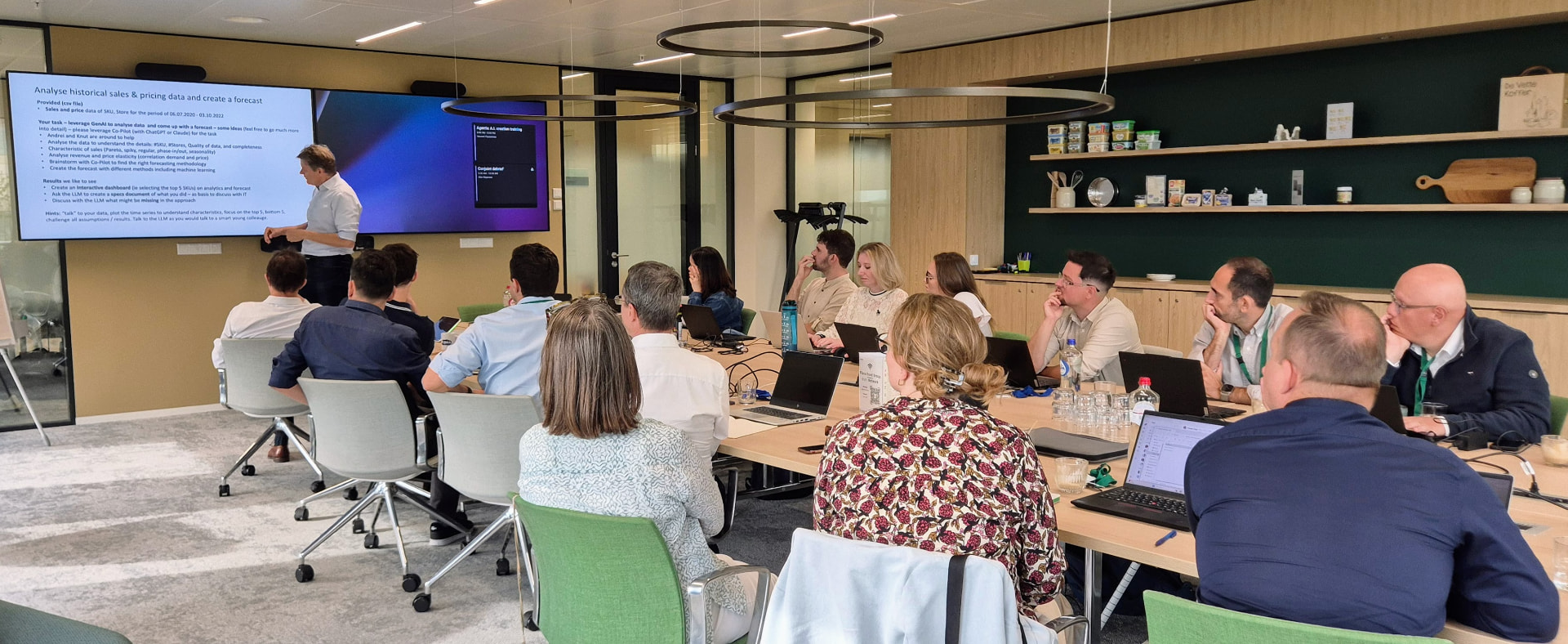 Workshop participants building a forecast from historical sales and pricing data.